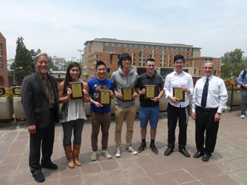 First Prize Winners - Team 13 from left to right Joe Zhou, Cheney Mao, Joey Nicolino, Clara Takahashi, Michael Wu, Cheney Mao, Joey Nicolino, Joe Zhou – the team is flanked by (left) Jason Hatakeyama (Boeing) and Prof. Robert Shaefer (right).