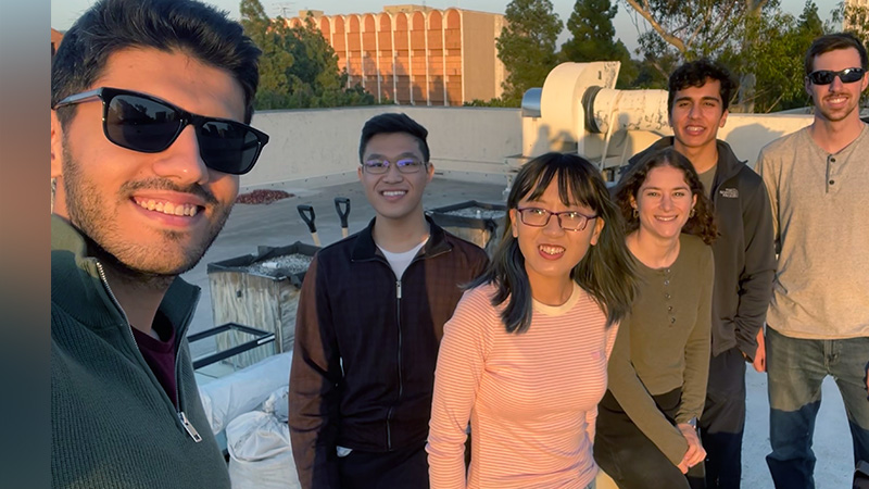 Chen Zheng (center) with her teammates working on collecting thermal data from a prototype portable solar panel system developed by a startup. Courtesy of Chen Zhang.